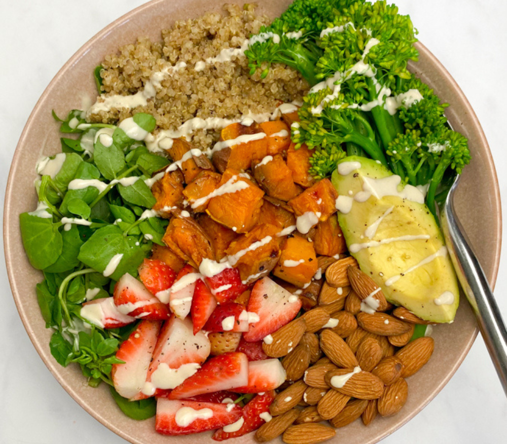 Spring Lunch Bowl with broccoli, avocado, strawberries, almonds, watercress and quinoa with greek yoghurt