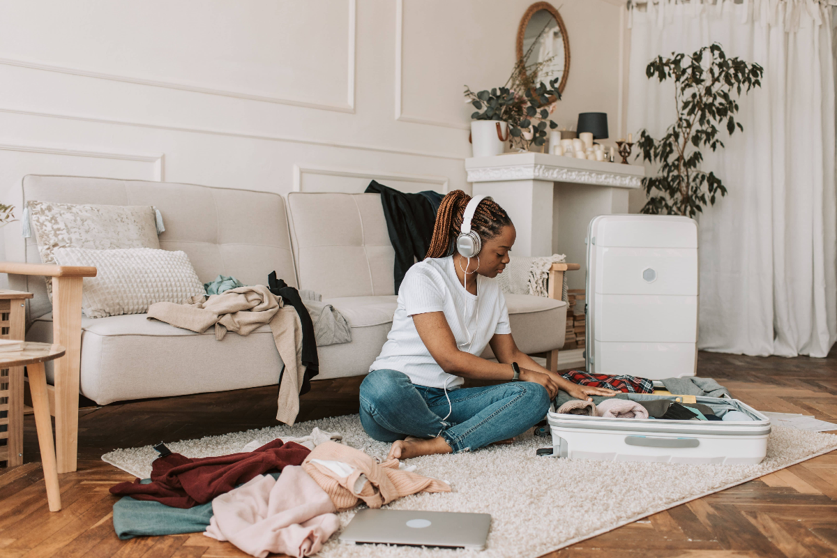 Listening-to-music-while-packing-for-a-holiday