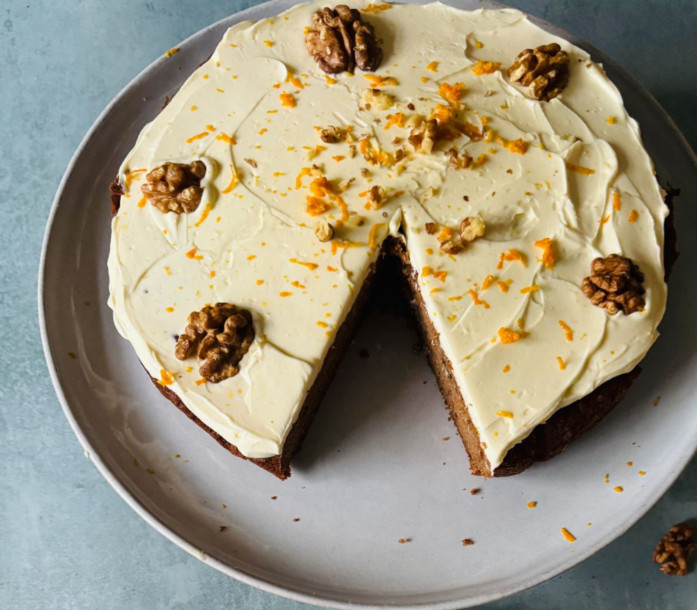 Carrot cake with walnuts on a large white dish
