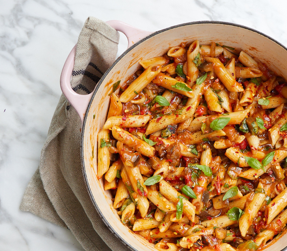 Easy Aubergine Arrabiata In a pot on a marble kitchen countertop