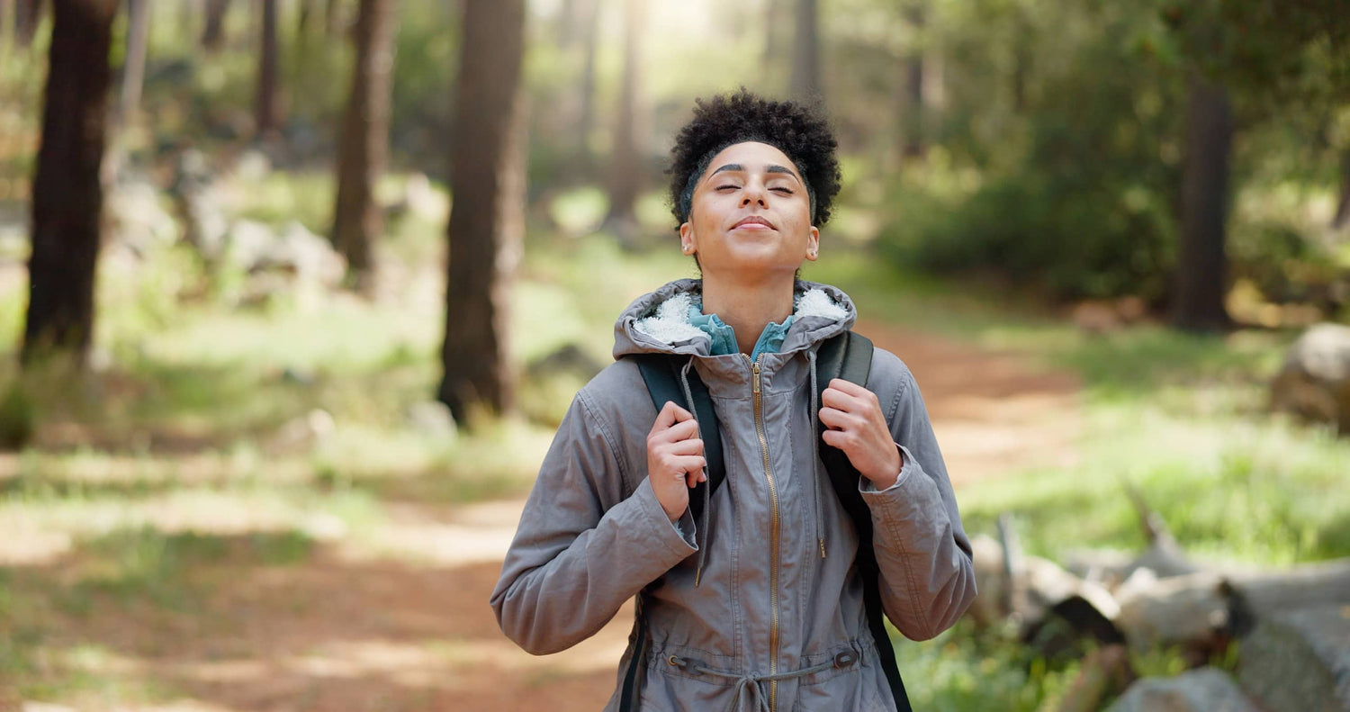A lady walking outdoors in nature