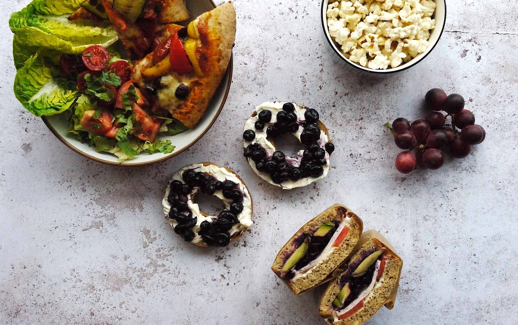 fruity bagels, pizza and salad, sandwiches, fruit and popcorn