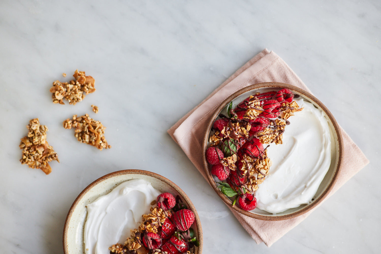 buckwheat crunch bowl with yoghurt and berries on a white countertop