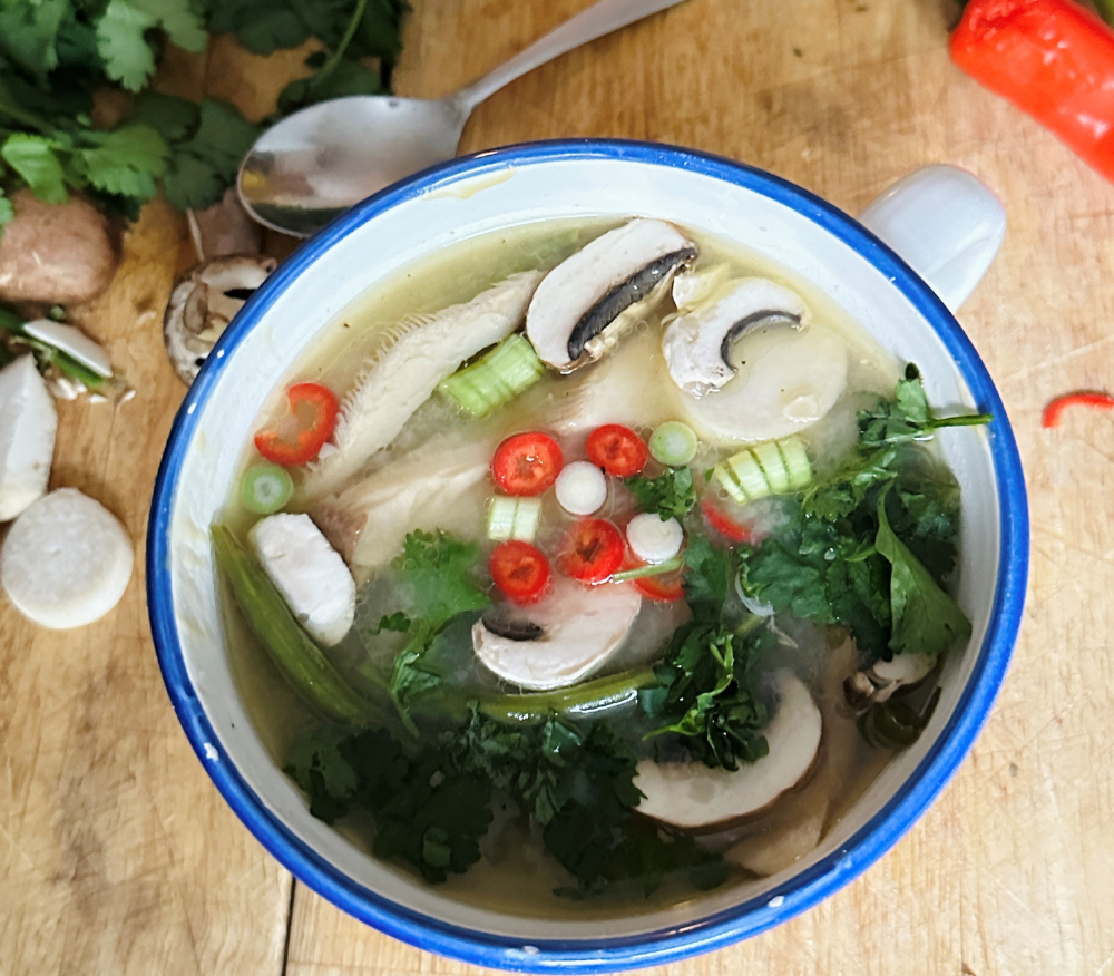 A bowl of mushroom miso soup packed with veg
