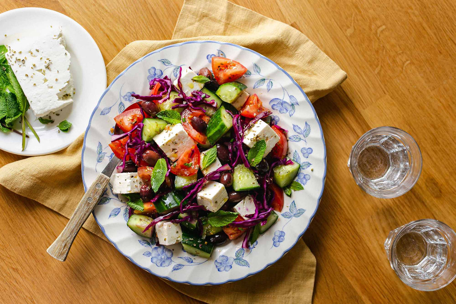 Greek salad including tomatoes, peppers, cucumbers and feta