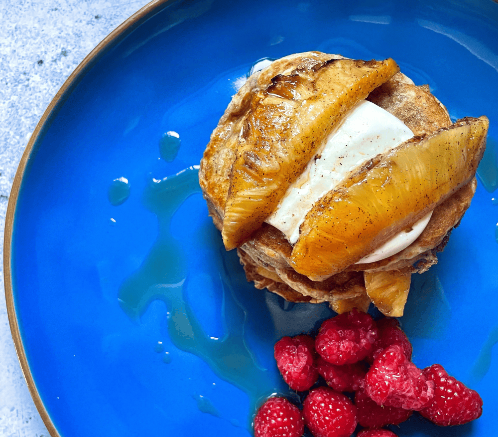 Overnight oat pancakes with roasted pineapple on top