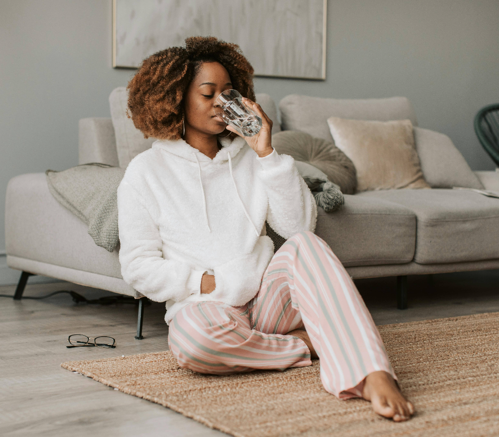 enjoying-a-glass-of-water-while-relaxing-in-pyjamas