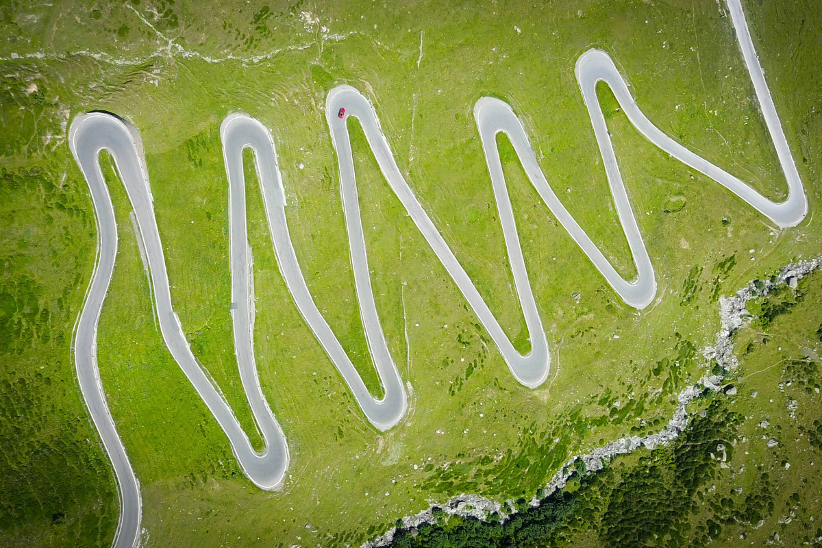 a-winding-path-against-a-green-background