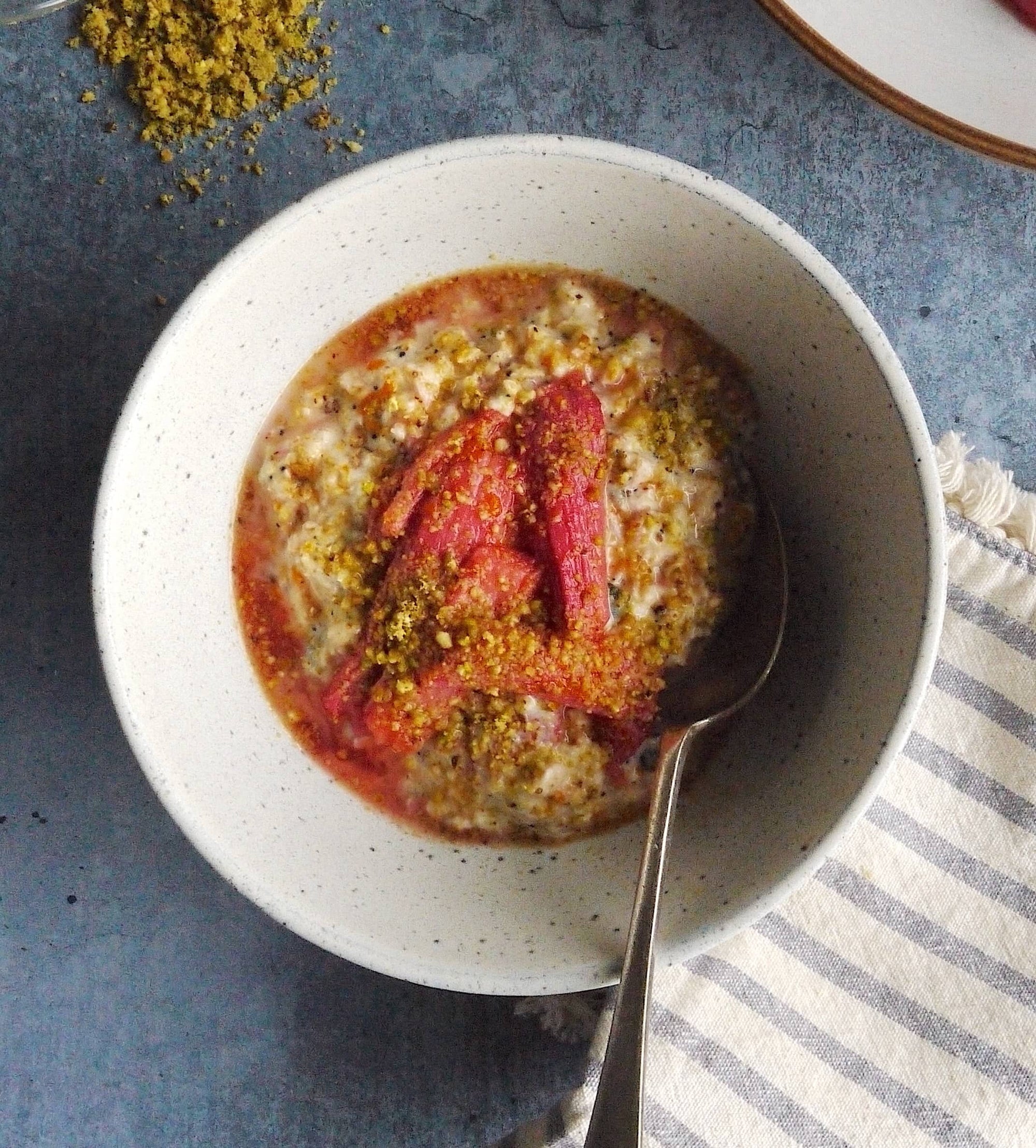 a bowl of roasted rhubarb and pistachio bircher