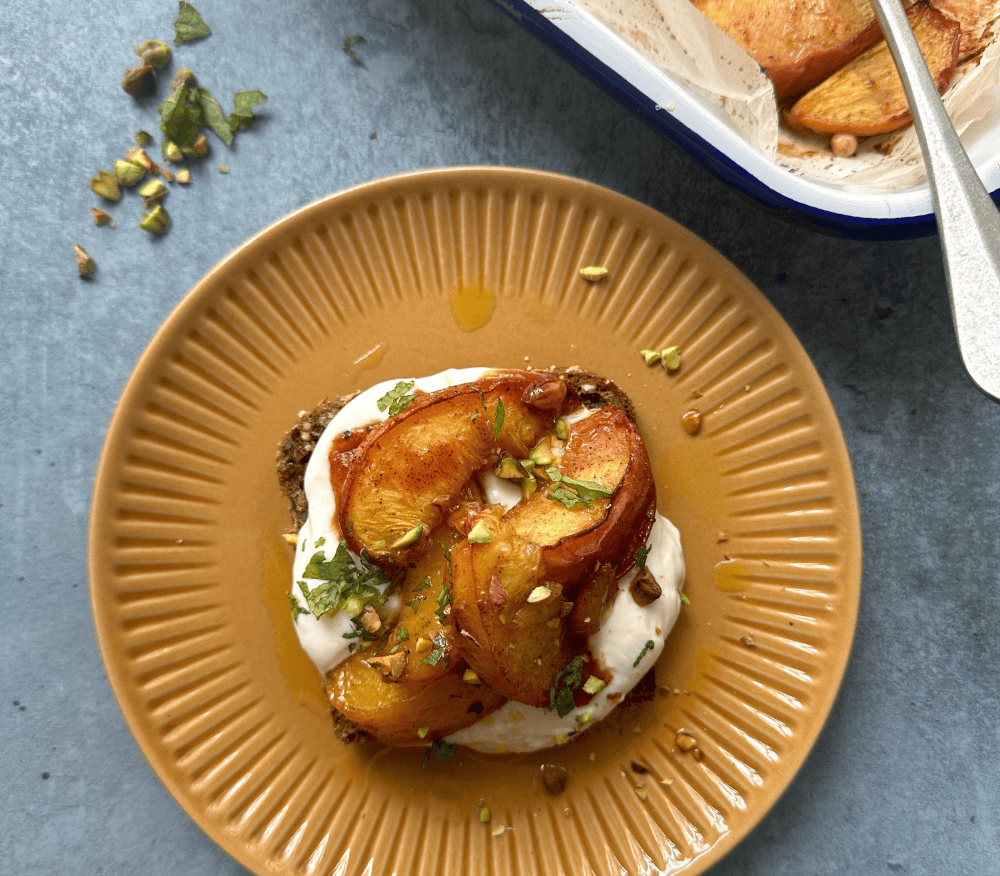 Whipped ricotta toast with roasted peaches and pistachios by Laura Tilt