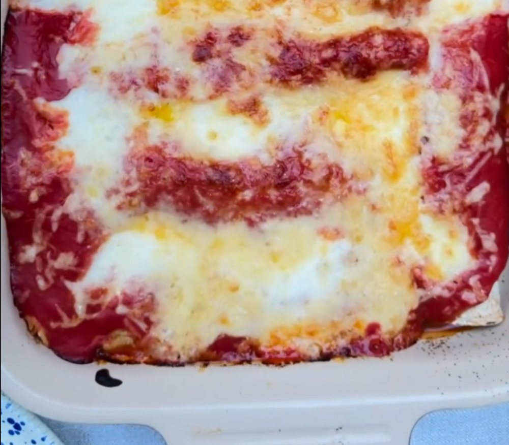 A sizzling tray of enchiladas