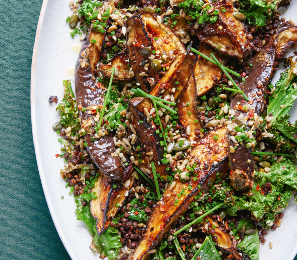 Plate of sticky miso aubergines with crunchy seeds made by Ella Mills