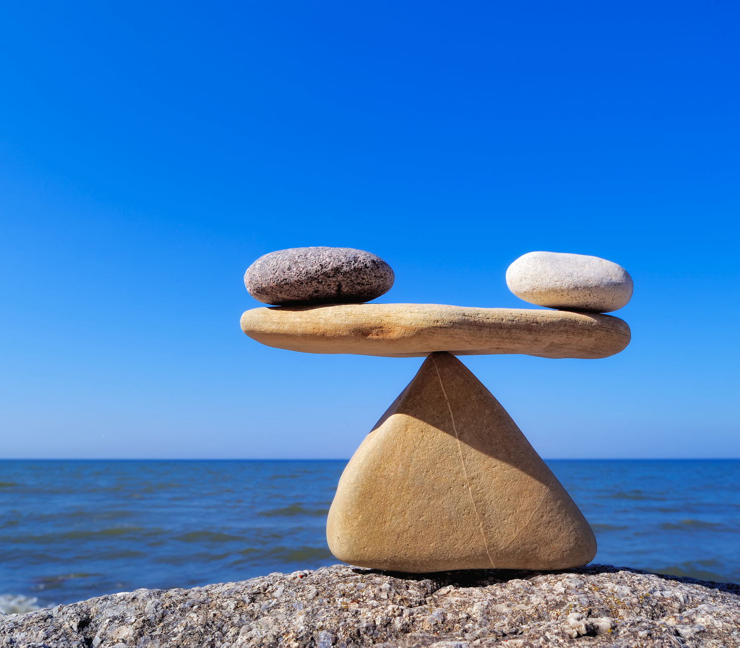 Pebbles balancing on a rock