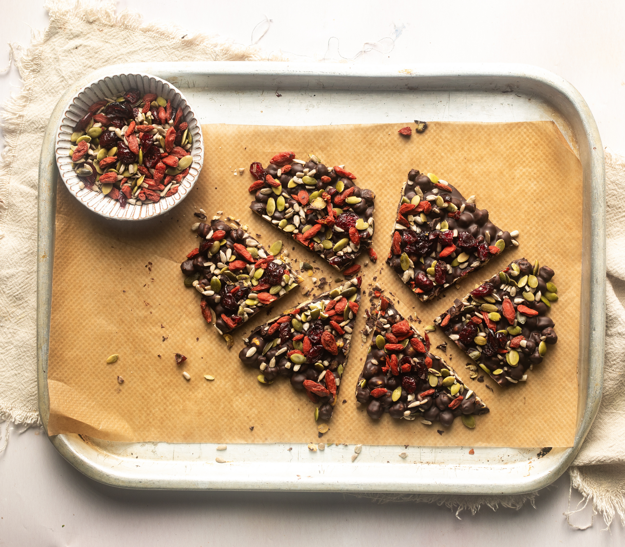 Gut loving snack : chickpea bark with mixed seeds, dried fruit and dark chocolate