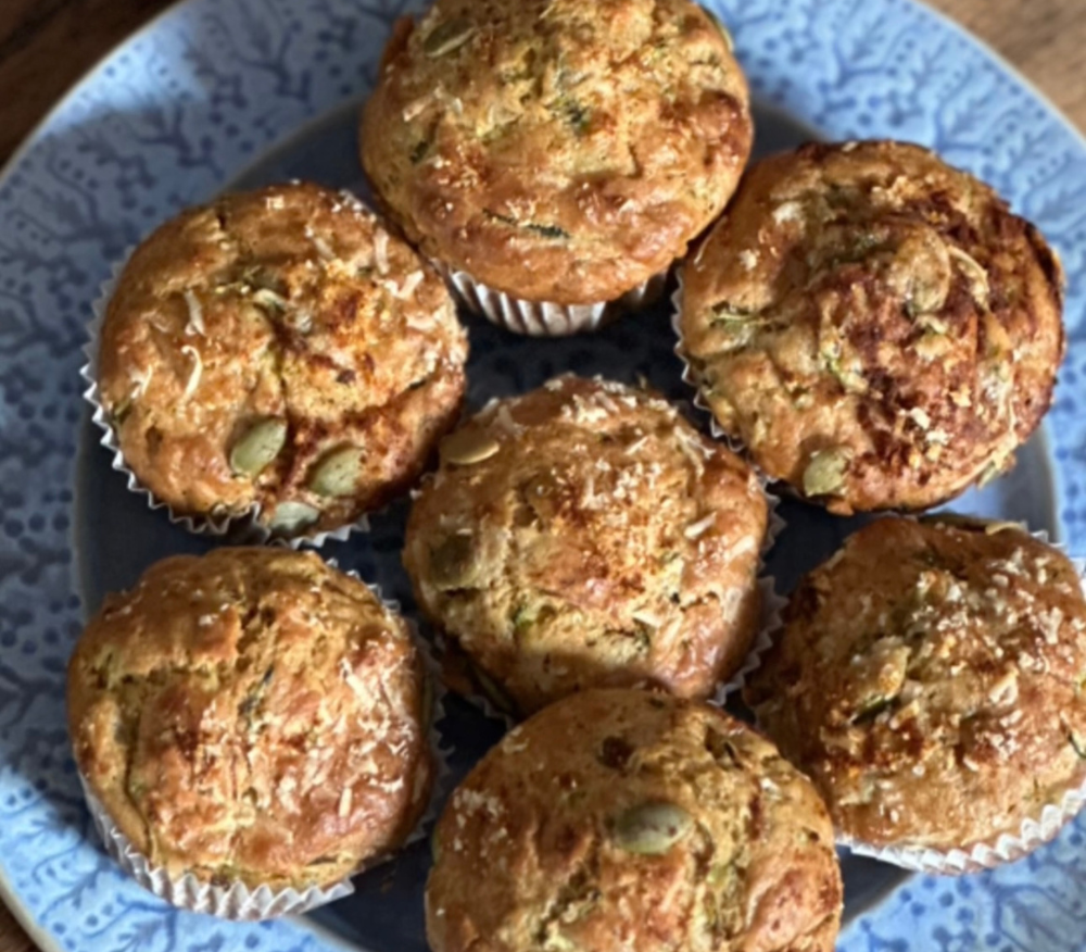 A plate loaded with courgette and parmesan breakfast muffins