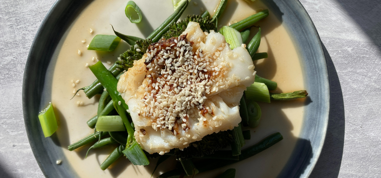 Springtime miso cod on a bed of greens